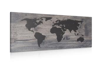 Obraz mapa świata na ciemnym drewnie