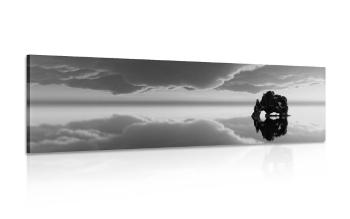 Obraz skała pod chmurami w wersji czarno-białej - 150x50