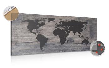 Obraz na korku mapa świata na ciemnym drewnie