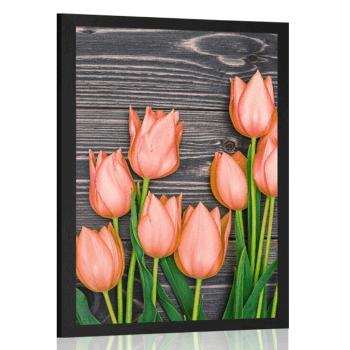 Plakat pomarańczowe tulipany na drewnianym tle